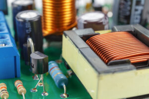Transformer and electronic components installed on a printed circuit board closeup